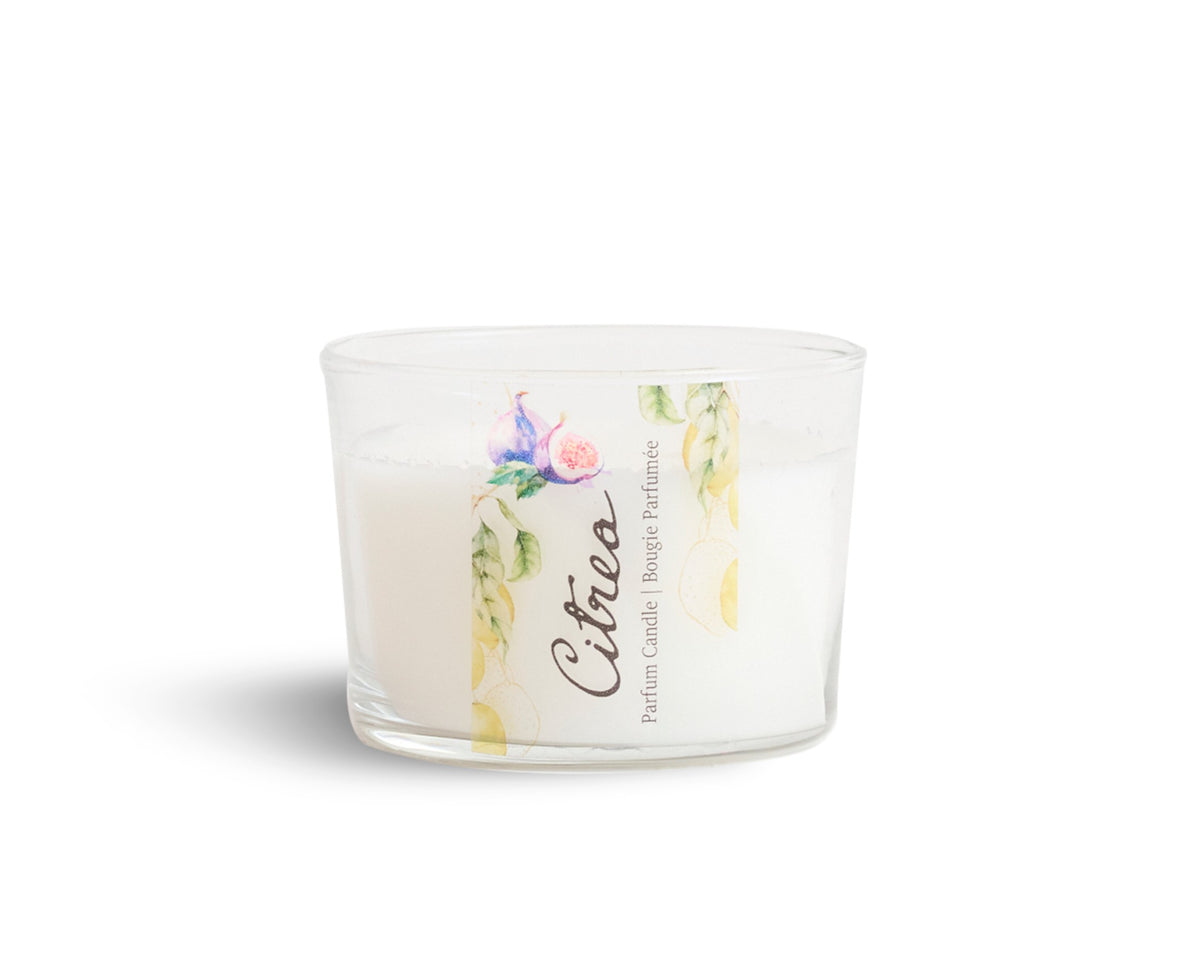 A white, handmade perfume candle with floral design, contained in a clear glass jar with the brand name 'Citrea' written on the front.